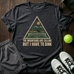 The Mountains Are The Calling But I Have To Dink T-Shirt — Dark Heather